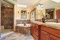 Lovely master bathroom with stone floor and large shower. Royalty Free Stock Photo