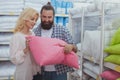 Lovely mature couple buying new pillows Royalty Free Stock Photo