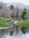 Memory Grove Park views of Waterfalls and streams leading into a small pond or lake surrounded by walking paths and trees in Salt Royalty Free Stock Photo