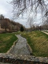 Memory Grove Park views of Waterfalls and streams leading into a small pond or lake surrounded by walking paths and trees in Salt Royalty Free Stock Photo