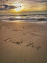 A love message I love you written on the sandy beach. Royalty Free Stock Photo