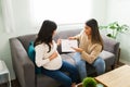 Pregnant woman and doula planning for childbirth Royalty Free Stock Photo