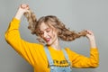 Lovely model girl smiling on gray background