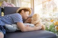 Lovely moment of asian cute boy playing with doll.