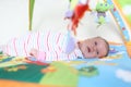 Lovely 1 months baby girl on playmat Royalty Free Stock Photo