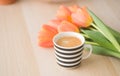 A lovely morning cup of  blackcoffee with orange tulips concetp for morning coffee from top views Royalty Free Stock Photo