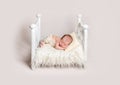 Lovely newborn baby on small crib Royalty Free Stock Photo