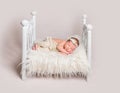 Lovely newborn baby on small crib Royalty Free Stock Photo