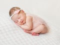 Lovely newborn girl sleeping on pink blanket Royalty Free Stock Photo