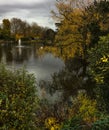 Lovely peaceful early autumn scene of pond and trees at Bletchley Park