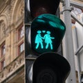 Lovely pedestrian traffic lights. Couple holding hands, green light. Vienna, Austria