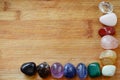 Rainbow Healing Crystals on wood table. Natural lighting with macro lens, rainbow stones. Clear Quartz, Pink Calcite, Jasper, Calc Royalty Free Stock Photo