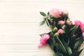 Lovely pink peonies on rustic white wooden background top view, Royalty Free Stock Photo