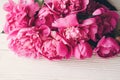 Lovely pink peonies on rustic white wooden background top view, Royalty Free Stock Photo