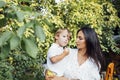 Lovely portrait of a beautiful mother hugging her little son