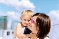 Lovely portrait of a mother and son outdoor laughing