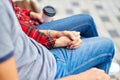 Lovely portrait of a young couple. They are sitting on the bench, embracing and kissing Royalty Free Stock Photo