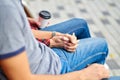 Lovely portrait of a young couple. They are sitting on the bench, embracing and kissing Royalty Free Stock Photo