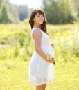 Lovely pregnant woman and flowers Royalty Free Stock Photo