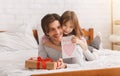 Lovely preschool girl greeting her dad with Father Day Royalty Free Stock Photo