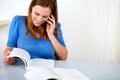 Lovely pretty woman speaking and browsing a book