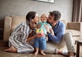 Lovely proud family - mother and father kissing their baby boy Royalty Free Stock Photo