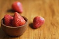 Lovely red fresh ripe strawberry in wood bowl on wooden table, copy space Royalty Free Stock Photo