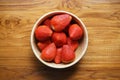 Lovely red fresh ripe strawberry in wood bowl on wooden table, copy space Royalty Free Stock Photo