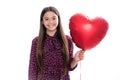 Lovely romantic teenage girl hold red heart balloon, symbol of love for valentines day isolated on white background Royalty Free Stock Photo