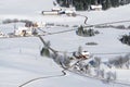 Lovely rural countryside on snowy winter day. Aerial view of barnyards and farm. Weitnau, Allgau, Bavaria, Germany. Royalty Free Stock Photo