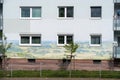 lovely rural German landscape mural on a high-rise building in silicate paint, with layers of soil with underground animals