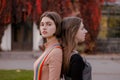 Lovely Sad girls stand back to back Royalty Free Stock Photo