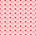 A lovely seamless pattern featuring alternating rows of solid and outline red hearts on a soft pink background. Vector Royalty Free Stock Photo