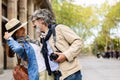 Lovely senior couple of tourist enjoying vacation together in city street Royalty Free Stock Photo