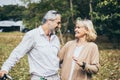 Lovely senior elderly happy couple man and woman with big laughing in romantic moment. Warm heart marriage and lover bonding and r Royalty Free Stock Photo