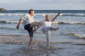 Lovely senior mature couple on their 60s or 70s retired walking happy and relaxed on beach sea shore in romantic aging together Royalty Free Stock Photo