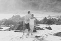 Lovely senior mature couple on their 60s or 70s retired walking happy and relaxed on beach sea shore in romantic aging together