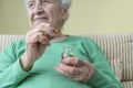 A lovely senior woman holding vitamin capsules Royalty Free Stock Photo