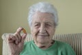 A lovely senior woman holding vitamin capsules Royalty Free Stock Photo