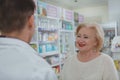 Lovely senior woman shopping at drugstore