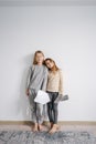 Lovely siblings posing with self-made toy paper swords and shields