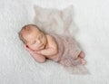 Lovely sleeping baby covered with light knitted shawl Royalty Free Stock Photo