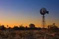 Lovely sunset in Kalahari with windmill and grass Royalty Free Stock Photo