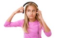 Lovely teenage girl removing her headphones for noise or loud music,isolated