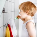 Lovely toddler boy brushing his teeth, indoors Royalty Free Stock Photo