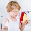 Lovely toddler boy brushing his teeth, indoors Royalty Free Stock Photo