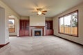 Lovely unfurnished living room with carpet.