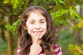 Portrait of girl pointing with finger her new adult tooth Royalty Free Stock Photo