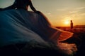 lovely wedding couple in sunset. Bride running to her groom. Man on the bsckground Royalty Free Stock Photo