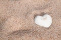 Lovely white shell heart on sand Royalty Free Stock Photo